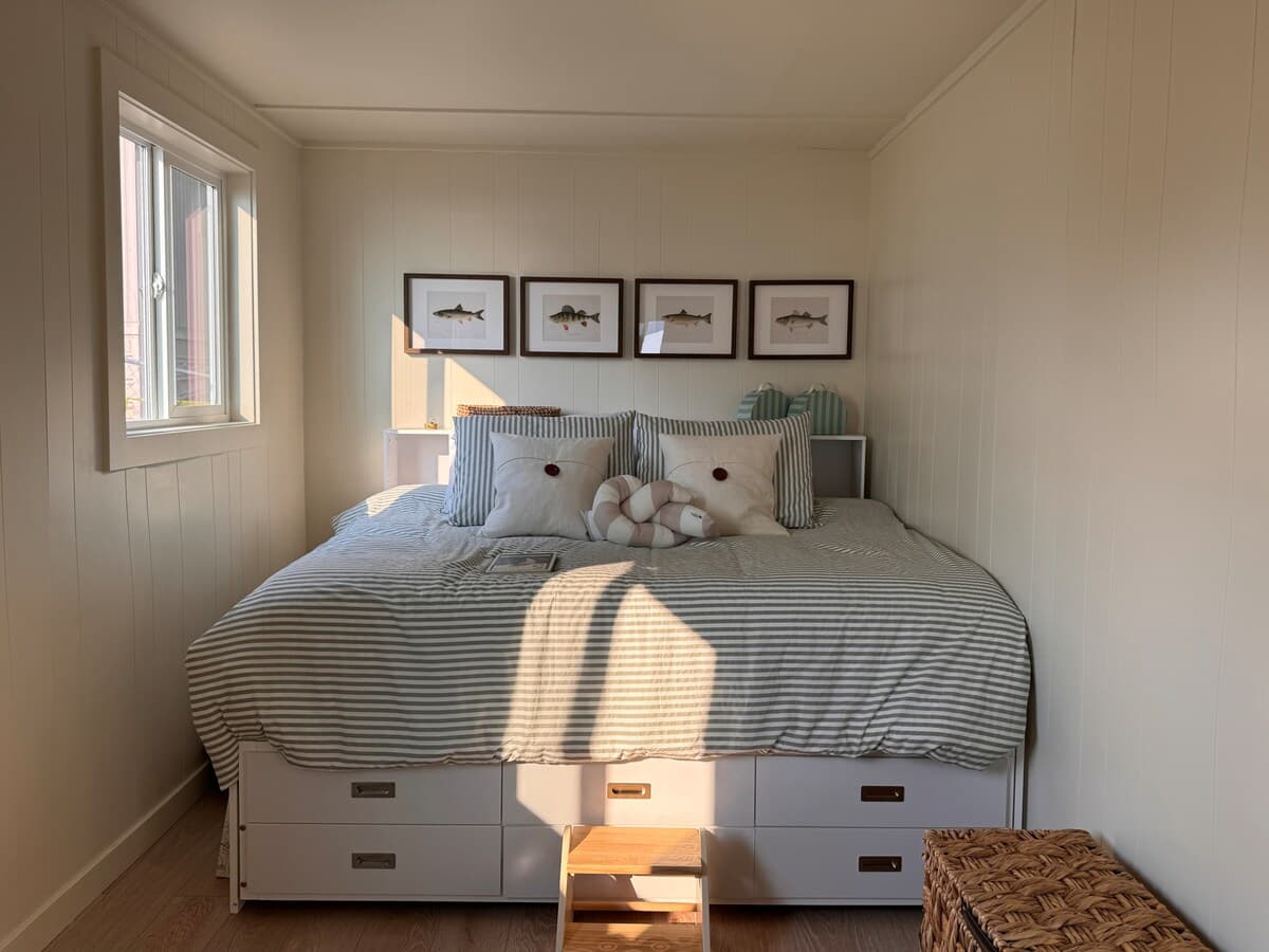 The bed in the second bedroom.