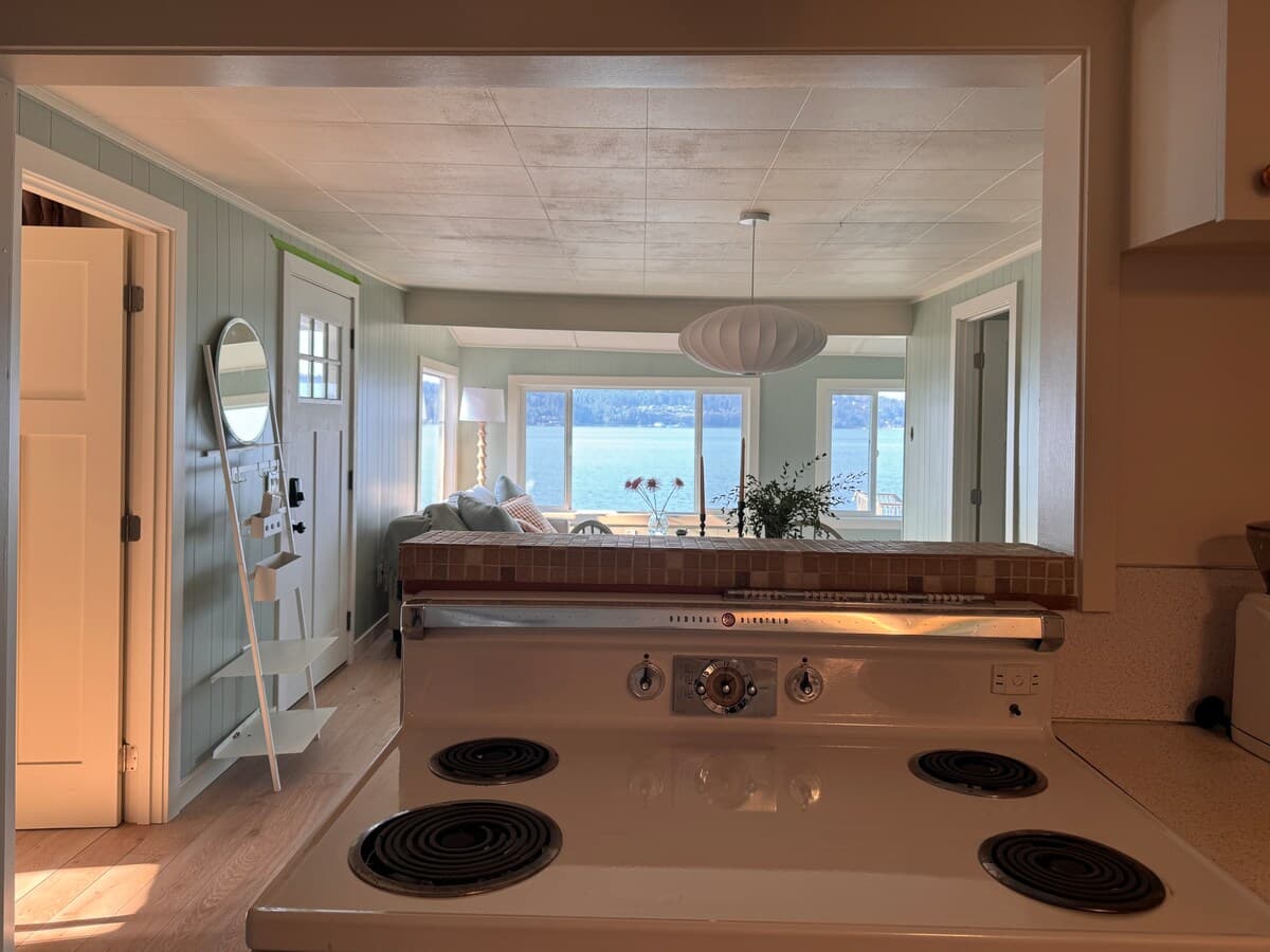 The vintage range, with the living room and the water beyond.