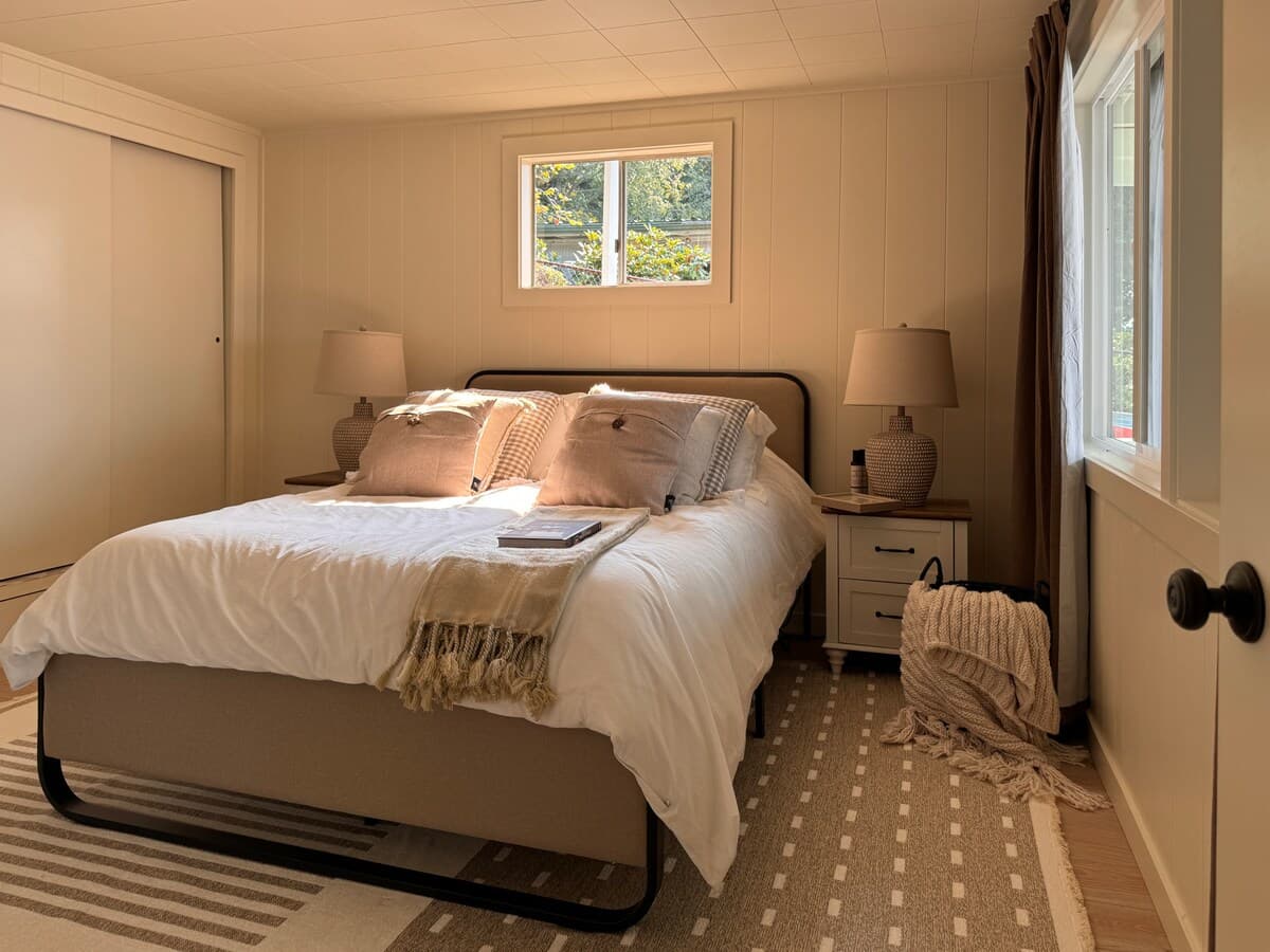 The bed in the main bedroom.